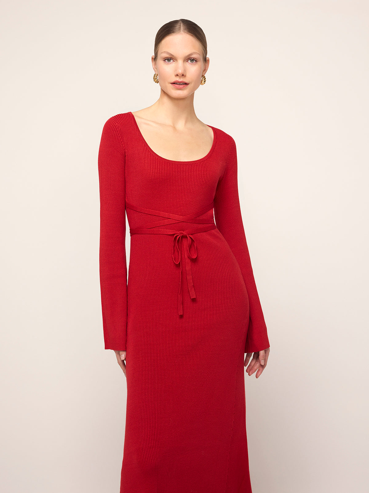 Darryl Red Ribbed Knit Dress - Darryl is a red ribbed knit midi dress with a flattering scoop neckline and feminine flare sleeves. Her ballet-inspired wrap-around tie waist detail flatters the silhouette. She'll look great with your favourite knee high boots.