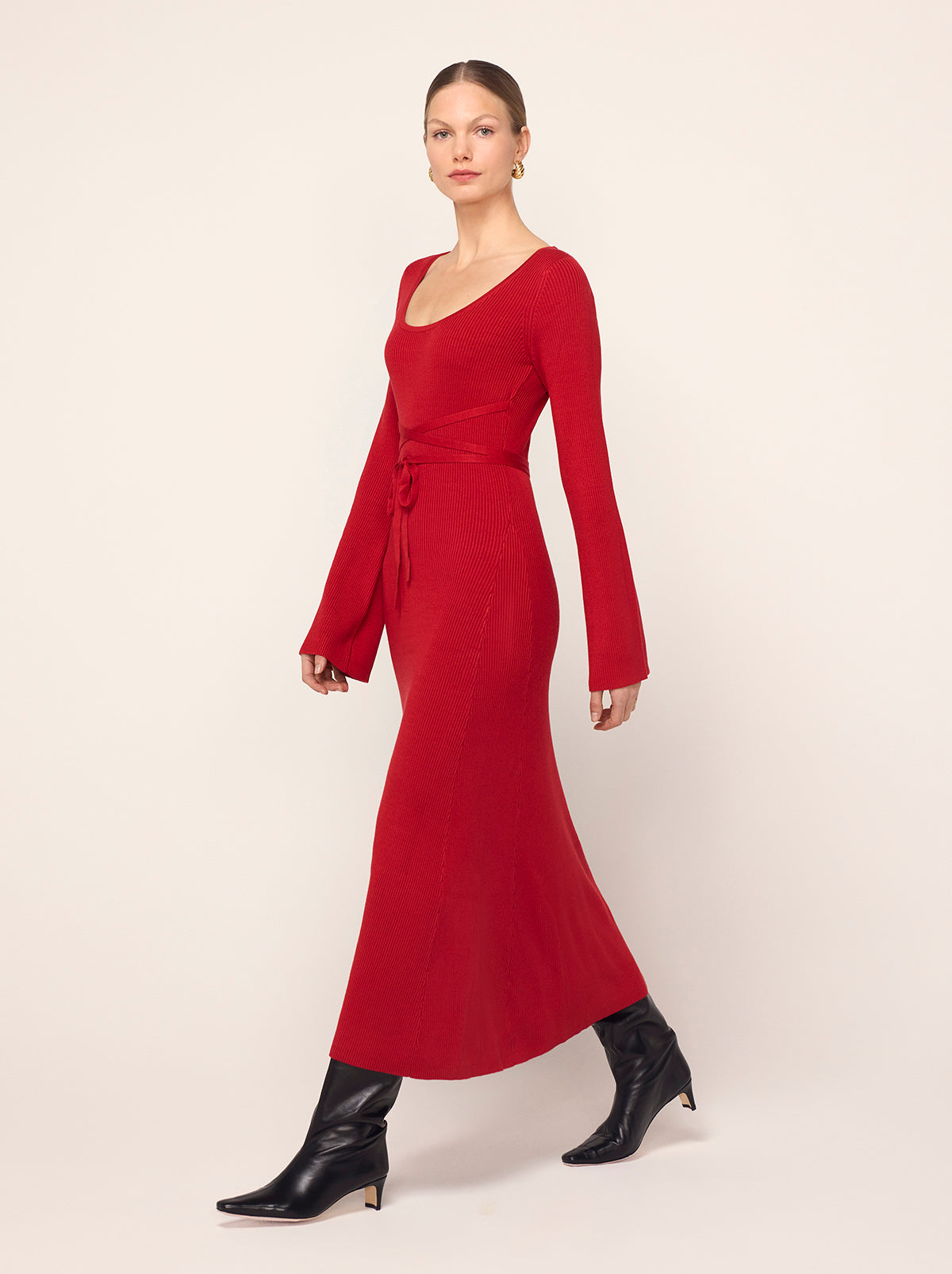 Darryl Red Ribbed Knit Dress - Darryl is a red ribbed knit midi dress with a flattering scoop neckline and feminine flare sleeves. Her ballet-inspired wrap-around tie waist detail flatters the silhouette. She'll look great with your favourite knee high boots.