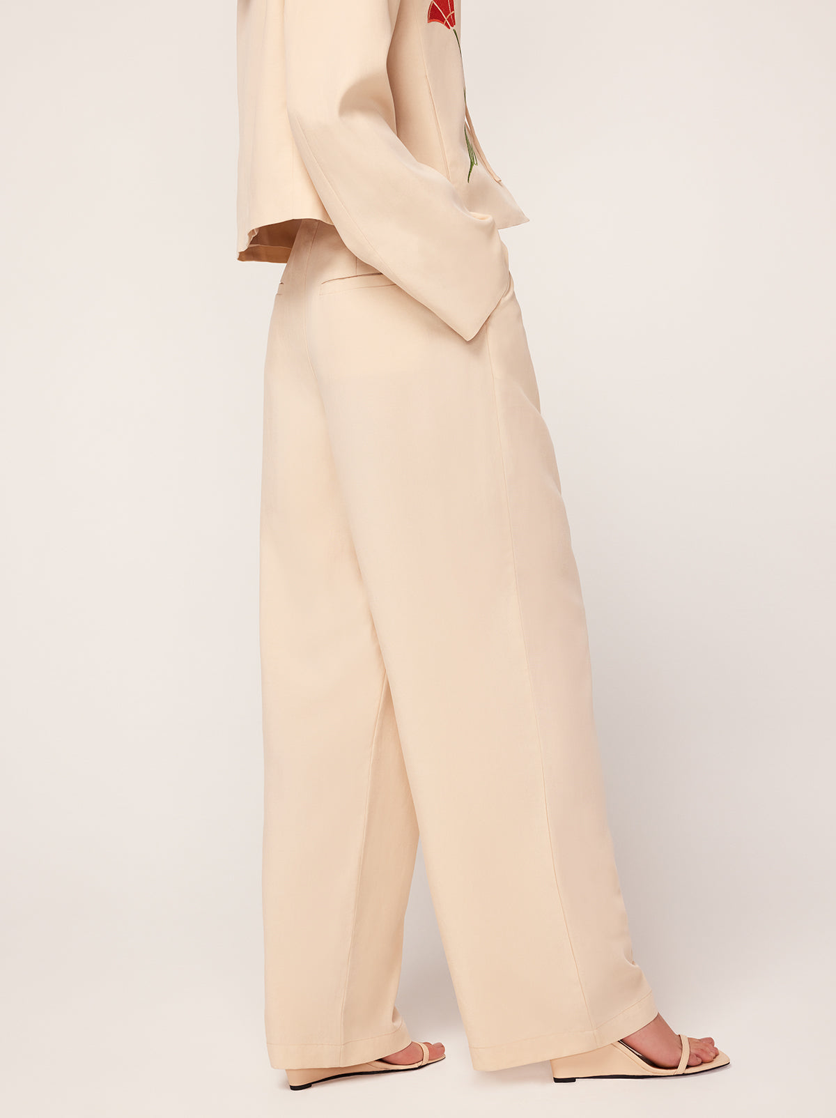 Edith Sand Pleated Front Trousers By KITRI Studio