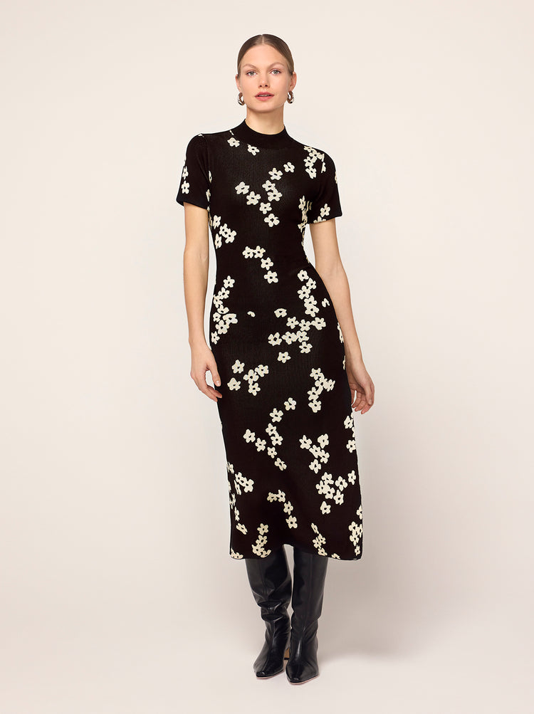 Jade Black Blurred Floral Knit Dress - Jade is a high mock-neck, short-sleeve dress crafted from flattering and figure-hugging jacquard knit with a compact finish. Her ballet-inspired wrap-around tie waist detail flatters the silhouette. She'll look great with your favourite knee high boots.