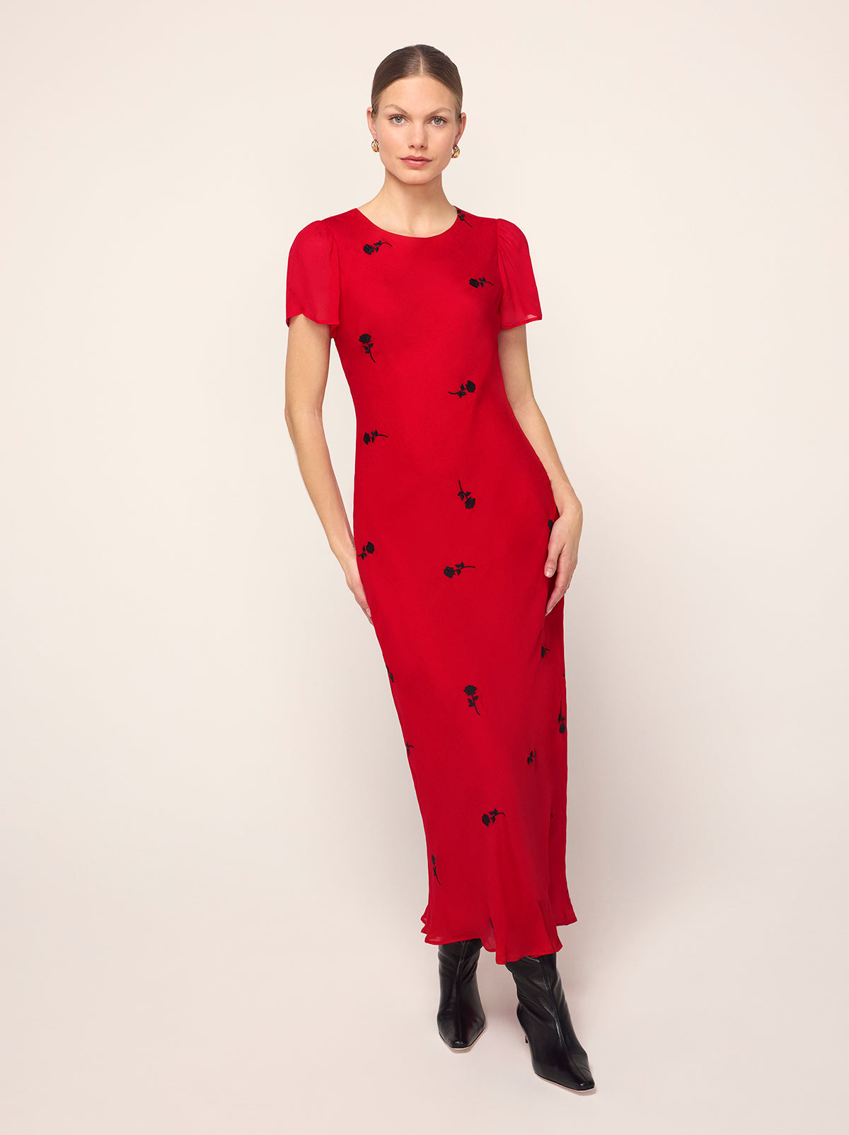 Marie Red Rose Embroidered Dress - Marie is a bias-cut midi dress featuring a flattering, figure-skimming skirt and cap sleeves for elegant coverage. Her lightweight georgette fabrication adds a tactile feel to the solid colour, with all-over contrast black rose embroidery.