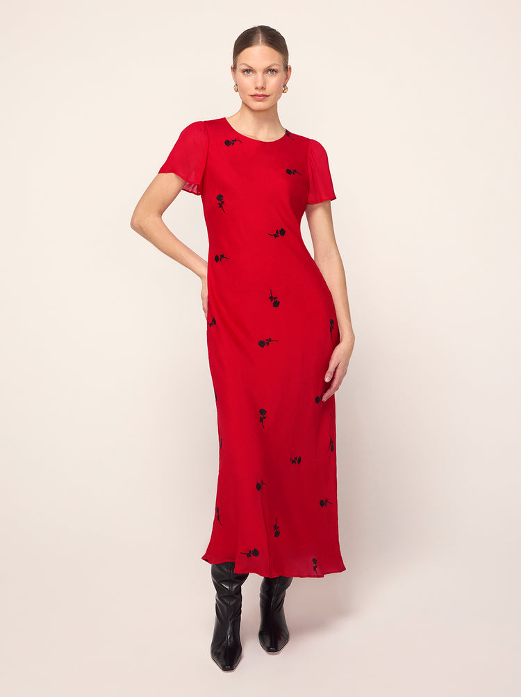 Marie Red Rose Embroidered Dress - Marie is a bias-cut midi dress featuring a flattering, figure-skimming skirt and cap sleeves for elegant coverage. Her lightweight georgette fabrication adds a tactile feel to the solid colour, with all-over contrast black rose embroidery.