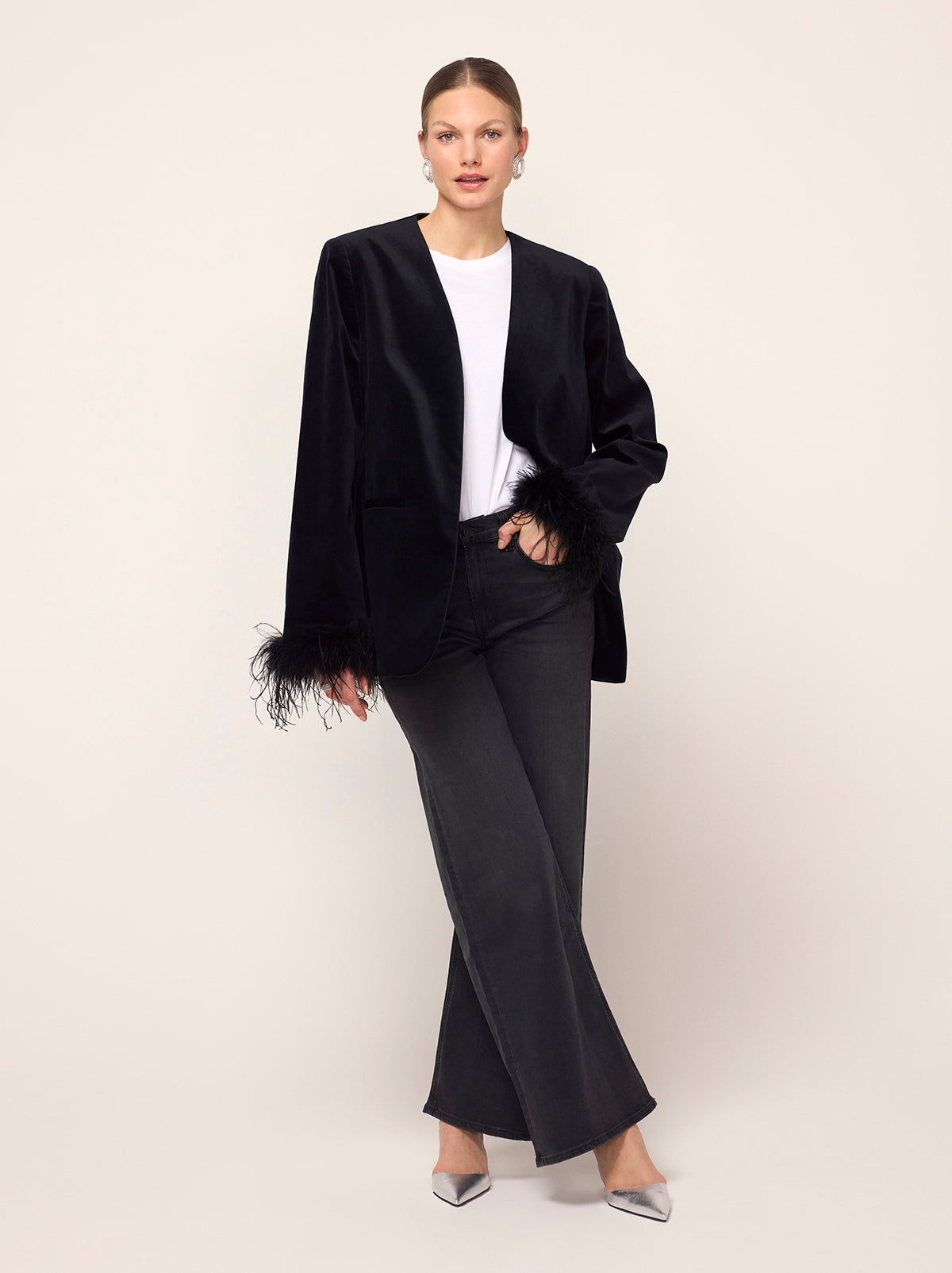 Marlene Black Velvet Feather Blazer - Marlene is an elegant, boxy blazer featuring detachable feather cuffs for multiple ways to wear. Crafted from our new cotton-blend velvet, she is structured whilst still feeling soft to the touch. Pair with co-ordinating Rosamund Black Velvet Trousers and Lou Lou Black Velvet Feather Top.