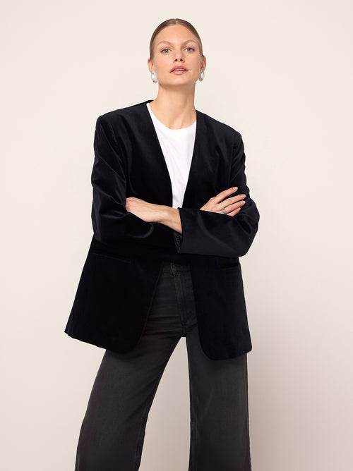 Marlene Black Velvet Feather Blazer - Marlene is an elegant, boxy blazer featuring detachable feather cuffs for multiple ways to wear. Crafted from our new cotton-blend velvet, she is structured whilst still feeling soft to the touch. Pair with co-ordinating Rosamund Black Velvet Trousers and Lou Lou Black Velvet Feather Top.