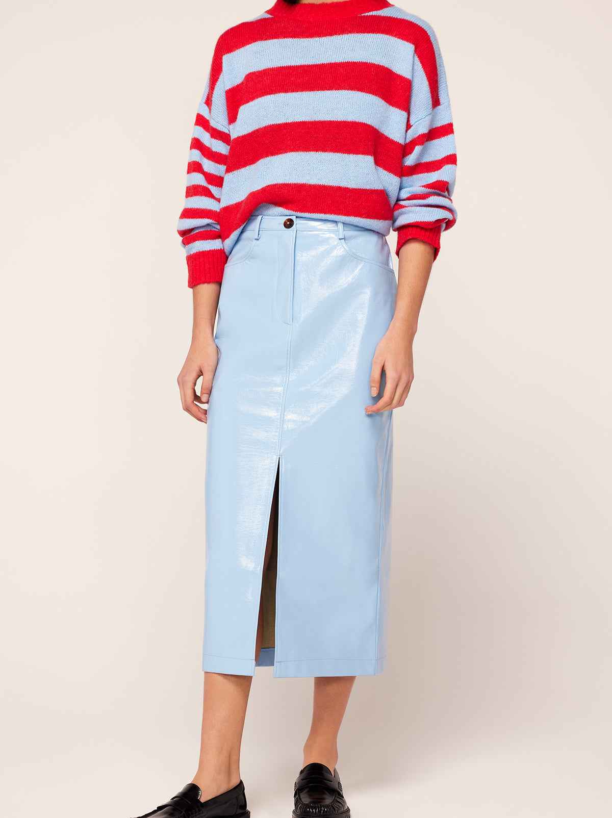 Penny Cornflower Blue Vinyl Skirt by Kitri Studio. Did someone say corporate cocktail? Penny is the ultimate 9-5 (or 5-9) companion.  A high-waisted skirt cut from glossy cornflower blue vinyl, she'll take you from desk to drinks with ease. Centre-front zip. Fitted. Straight skirt. Shell: 100% PU. Backing: 100% Viscose.