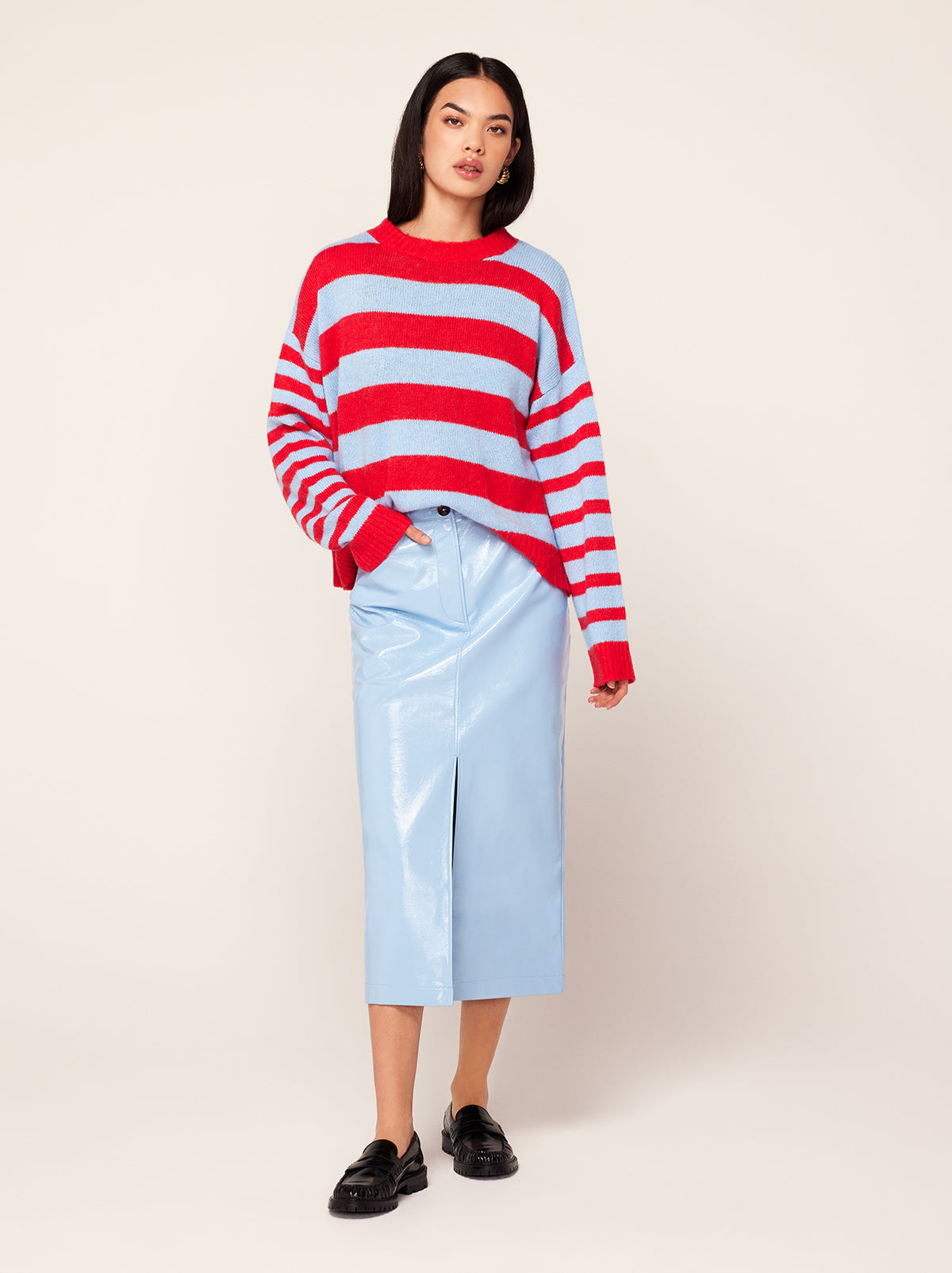 Penny Cornflower Blue Vinyl Skirt by Kitri Studio. Did someone say corporate cocktail? Penny is the ultimate 9-5 (or 5-9) companion.  A high-waisted skirt cut from glossy cornflower blue vinyl, she'll take you from desk to drinks with ease. Centre-front zip. Fitted. Straight skirt. Shell: 100% PU. Backing: 100% Viscose.