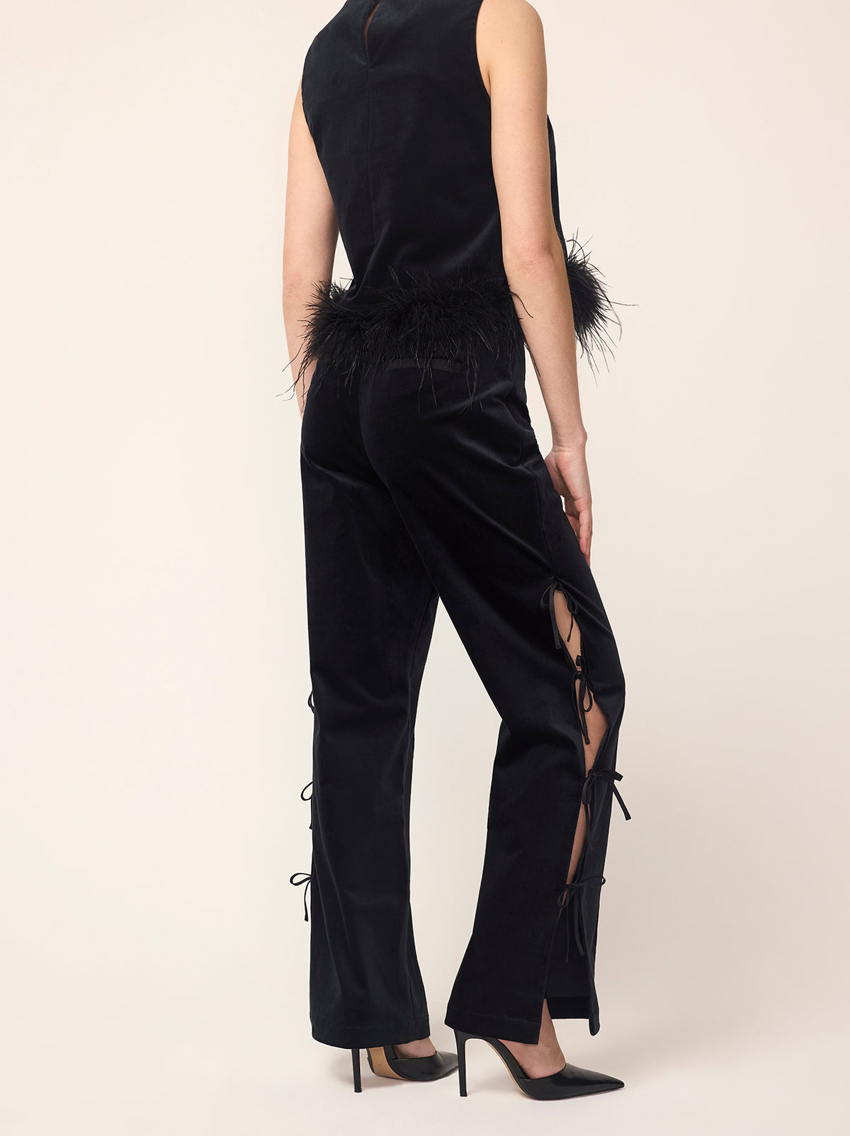 Rosamund Black Velvet Trousers - Rosamund is a straight-leg pin-tuck trouser with functional satin ties along to outer edge of each leg. Crafted from our new cotton-blend velvet, she is structured whilst still feeling soft to the touch. Pair with co-ordinating Marlene Black Velvet Feather Blazer and Lou Lou Black Velvet Feather Top.