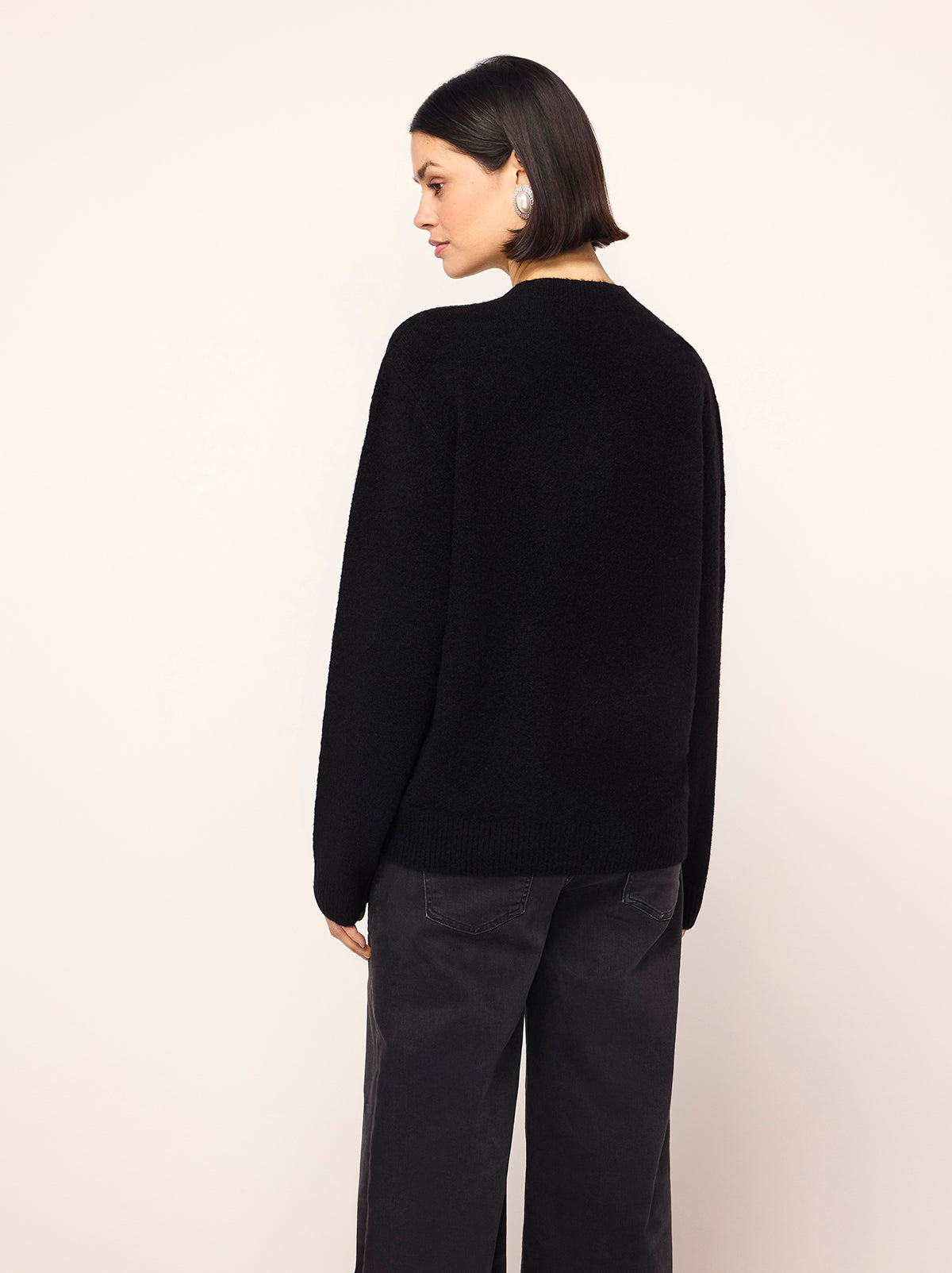 Rowan Black Rose Oversized Sweater - Rowan is a chic black jumper with long sleeves, a round neck and an in-house designed frosty rose motif inspired by the magic of a standing ovation, with roses raining from theatre balconies. 