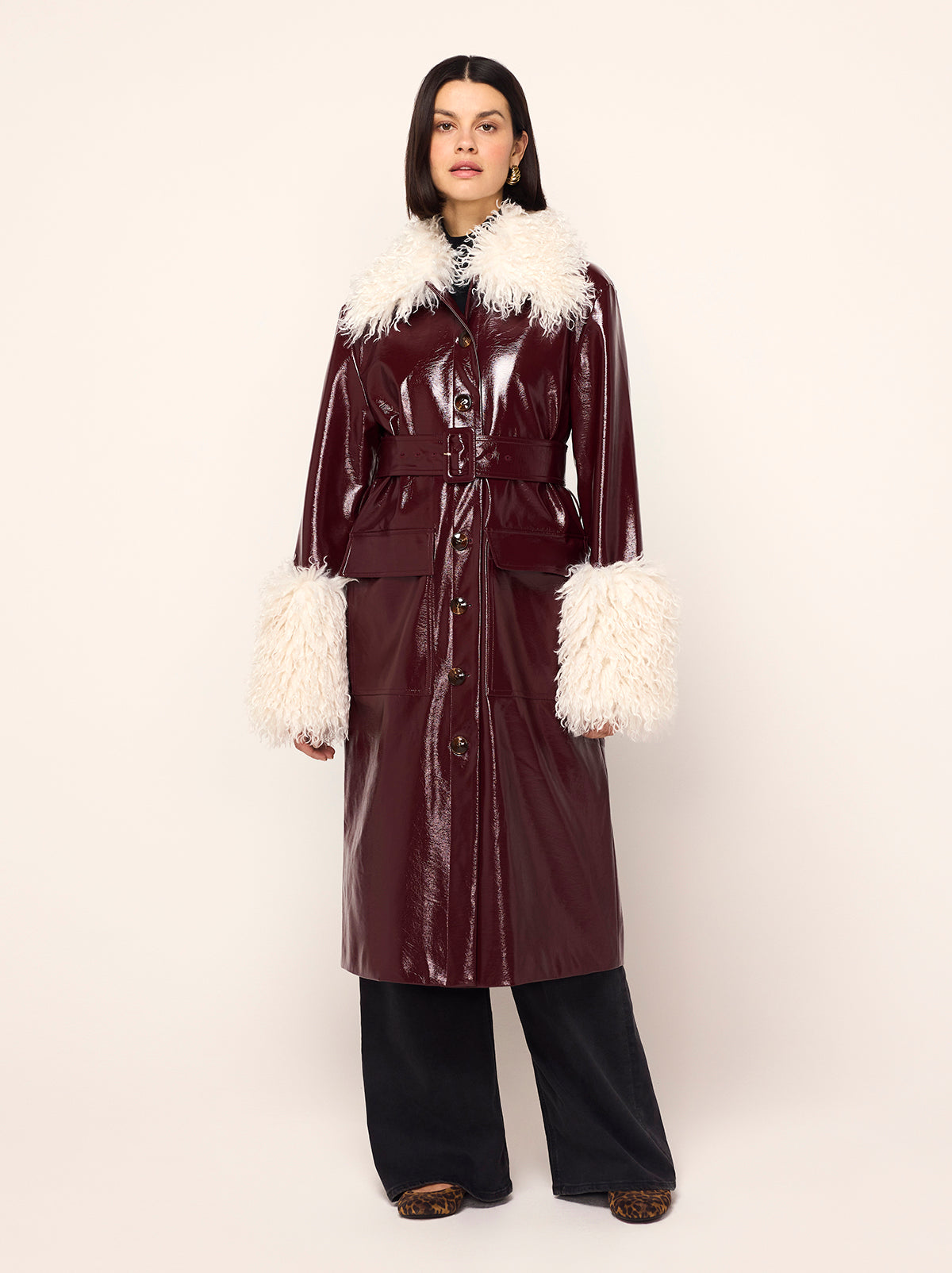 Simone Oxblood Vinyl Coat - Simone is a oxblood vintage-inspired vinyl coat with a removable faux-fur collar and cuffs for extra versatility. A relaxed fit with large patch pockets at the front, it comes with a buckled belt to cinch in at the waist.