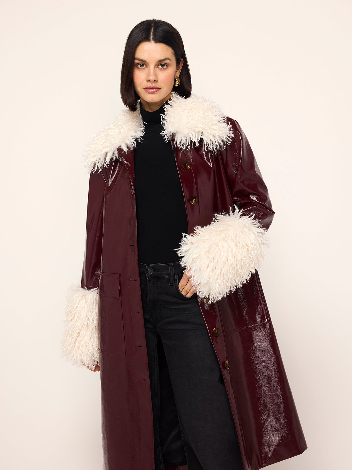 Simone Oxblood Vinyl Coat - Simone is a oxblood vintage-inspired vinyl coat with a removable faux-fur collar and cuffs for extra versatility. A relaxed fit with large patch pockets at the front, it comes with a buckled belt to cinch in at the waist.