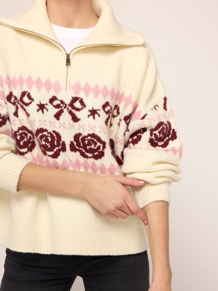 Uma Ivory Bow Fairisle Quarter Zip Sweater - Uma is an oversized, super-soft knit in a versatile cream shade, with a quarter-zip collar and oversized fit. She features a bow and rose motif in soft tonal pink and merlot red. Looks perfect with your favourite black jeans.